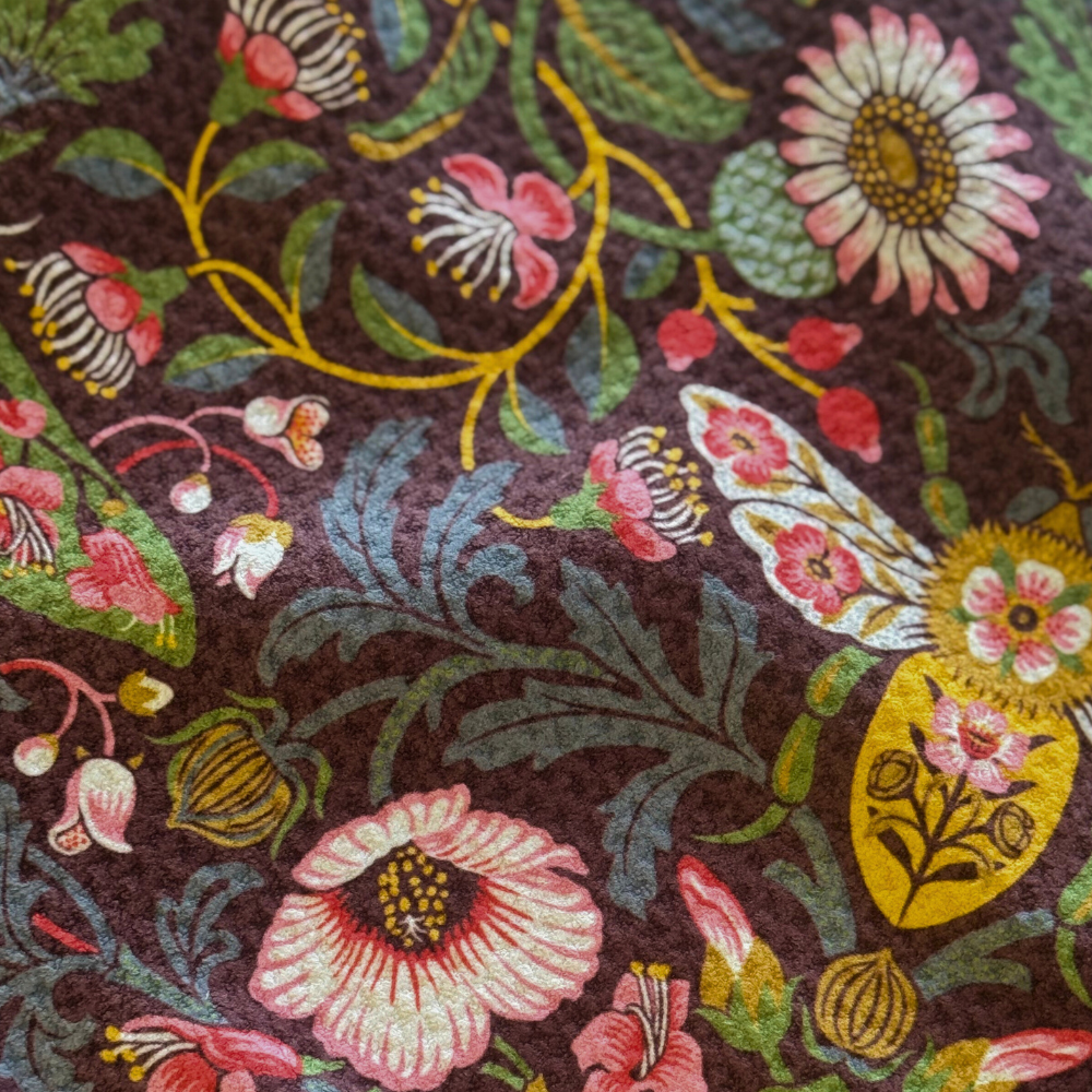 Close-up of a floral and butterfly pattern on fabric.