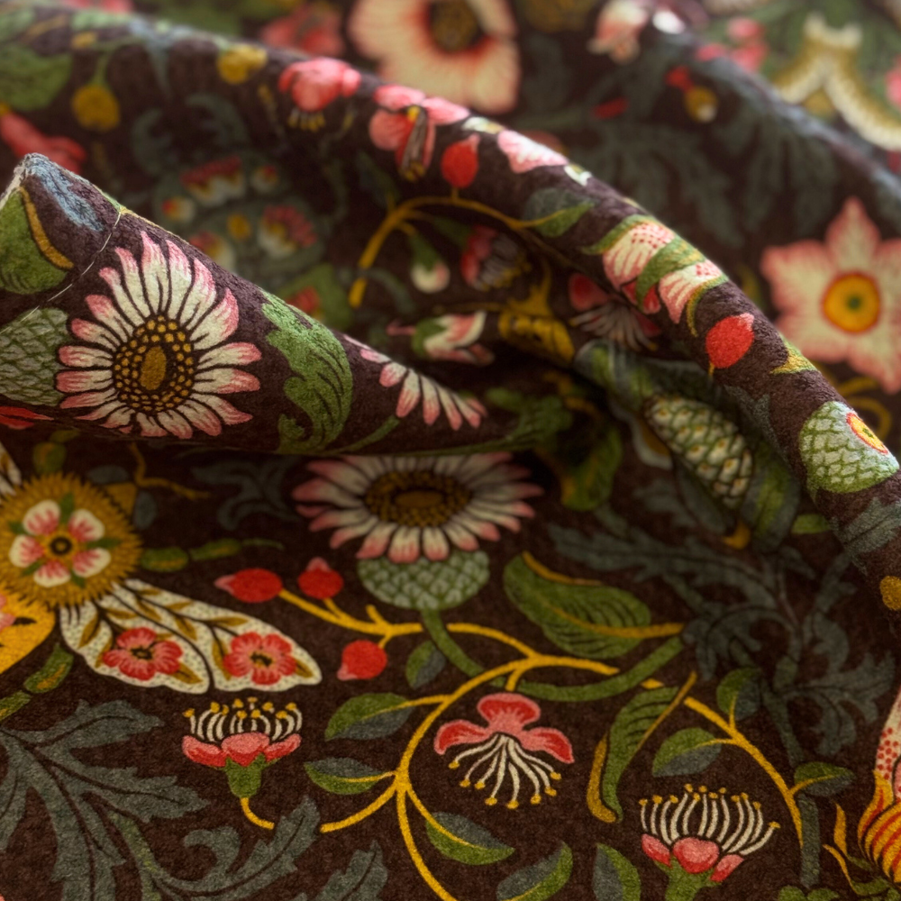 Close-up of floral fabric with intricate patterns on a dark background