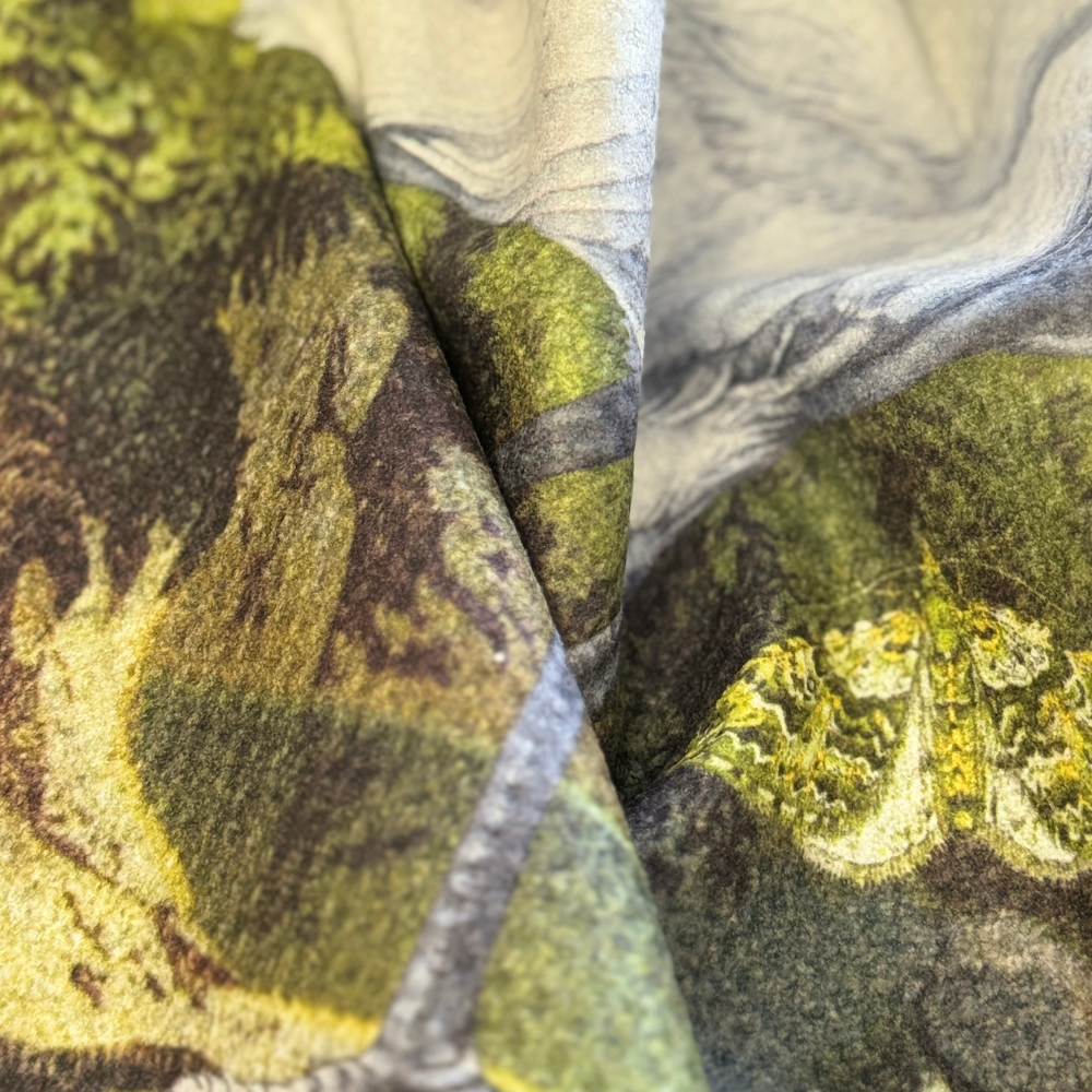 Close-up of textured fabric with green and brown patterns