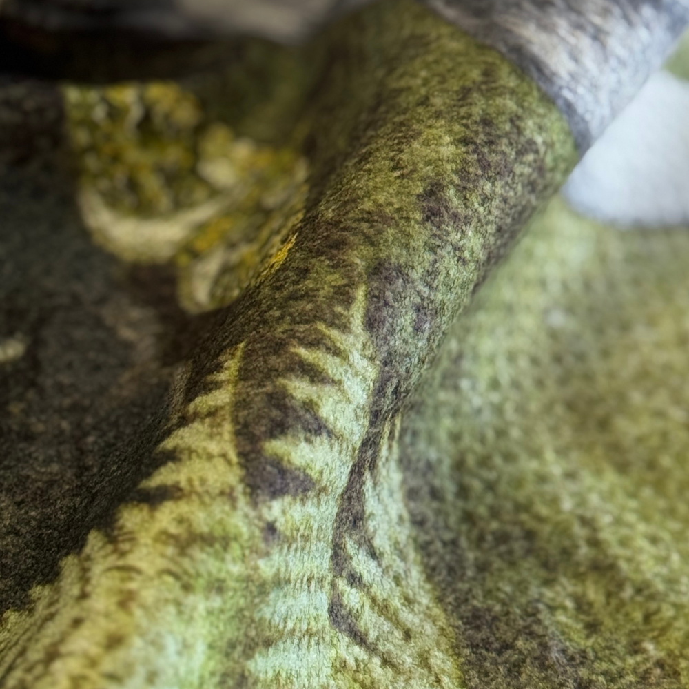 Close-up of a textured green fabric surface