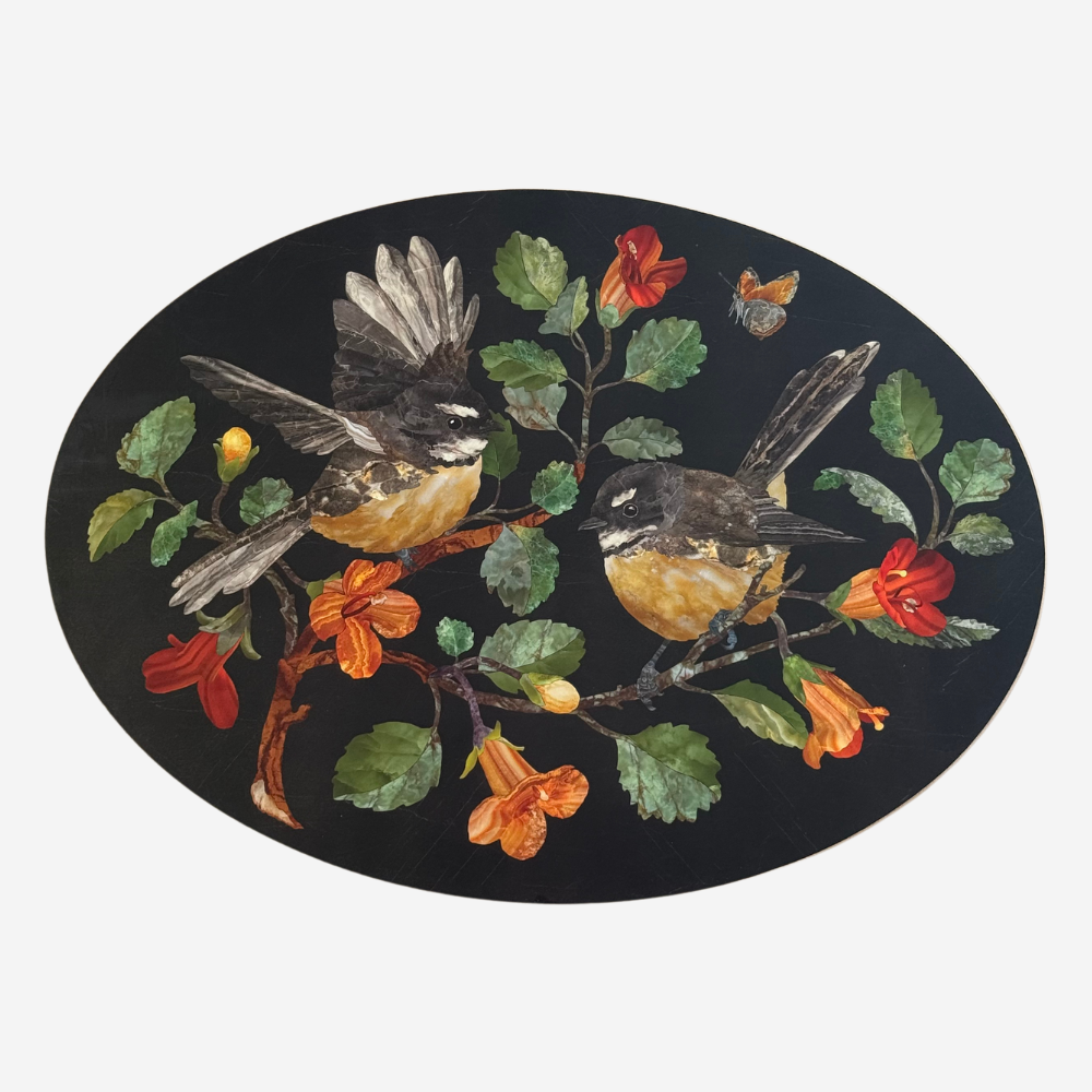 Decorative oval mat with birds and flowers on a black background