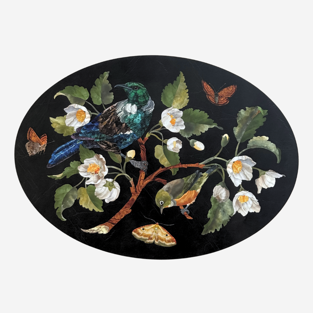 Decorative plate with birds, flowers, and butterflies on a black background