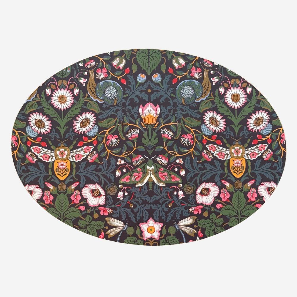 Decorative plate with intricate floral and insect pattern on a white background