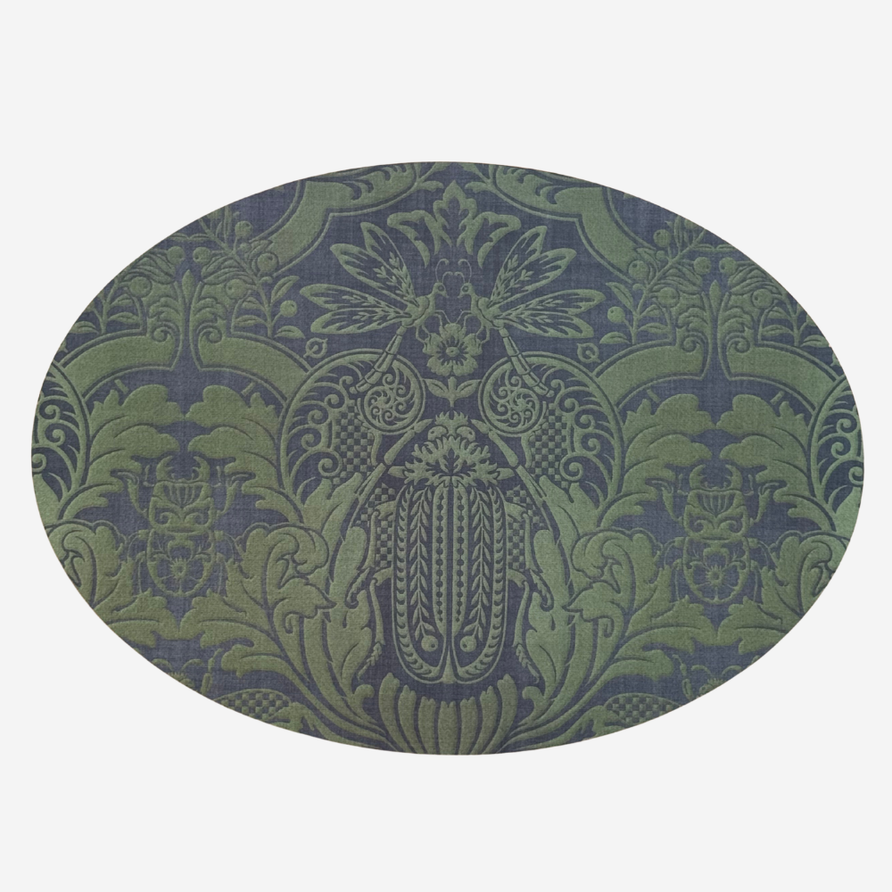 Decorative green and blue patterned round mat on a white background