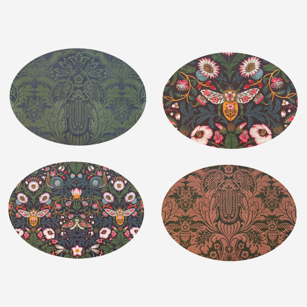 Four round coasters with floral and damask patterns on a white background