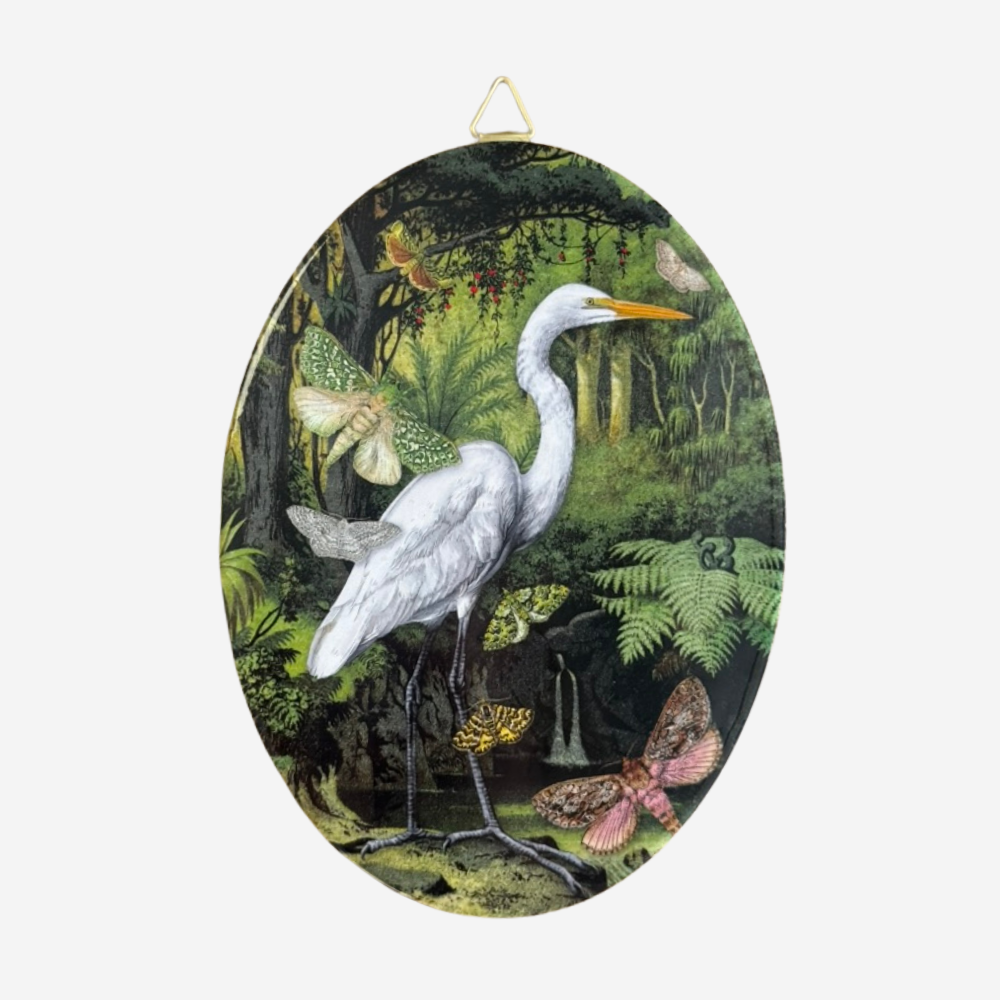 Decorative oval ceramic tile with a NZ white heron or kotuku and NZ moths by Tanya Wolfkamp