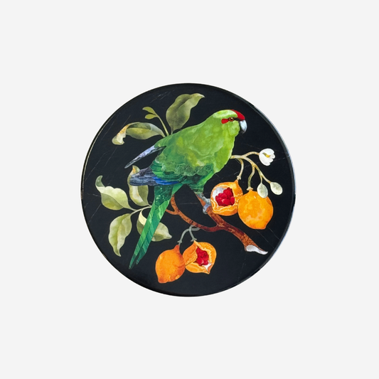 Pietra dura style coaster of kakariki bird and kohia passionfruit by Tanya Wolfkamp