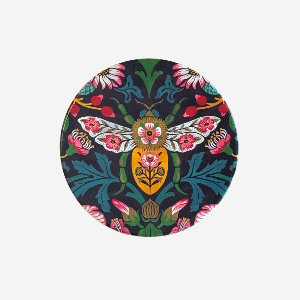 Round coaster with floral and insect design on a white background