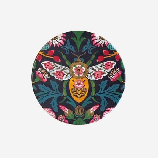 Round coaster with floral and insect design on a white background