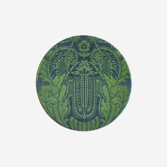 Round ceramic coaster with damask pattern huhu beetle in blue and green colourway by Tanya Wolfkamp