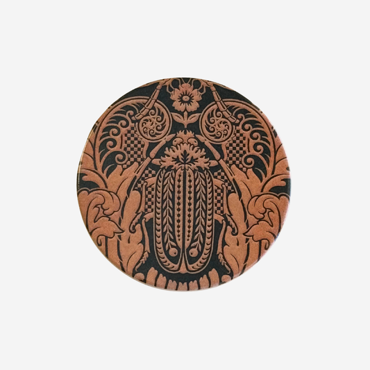 Round ceramic coaster with damask pattern huhu beetle in dark olive and peach by Tanya Wolfkamp