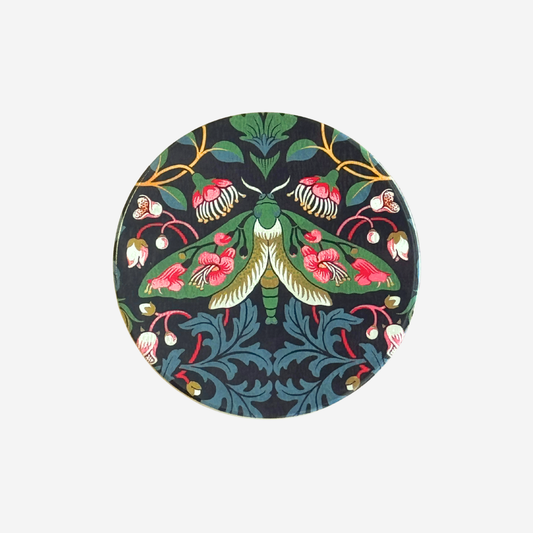 Ceramic coaster of puriri moth i a damask pattern by Tanya Wolfkamp