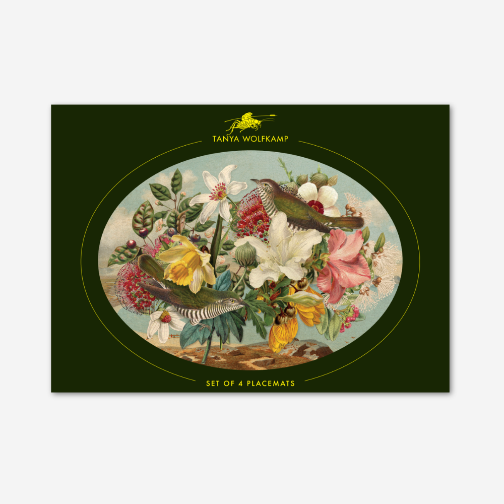 Placemat with bird and floral design on a green border, featuring Tanya Wolfkamp branding.