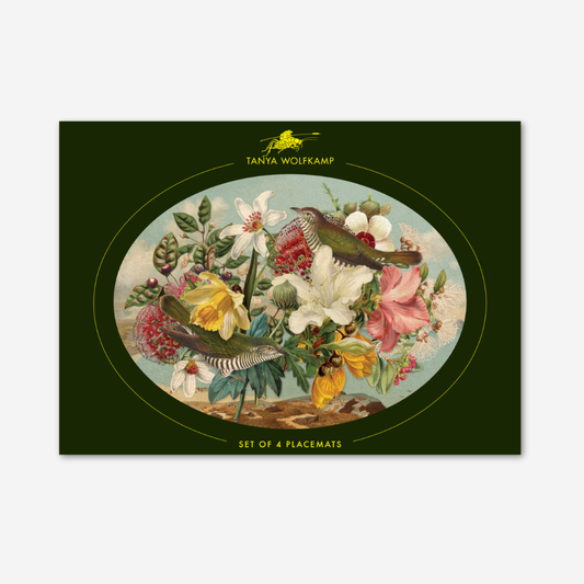 Placemat with bird and floral design on a green border, featuring Tanya Wolfkamp branding.