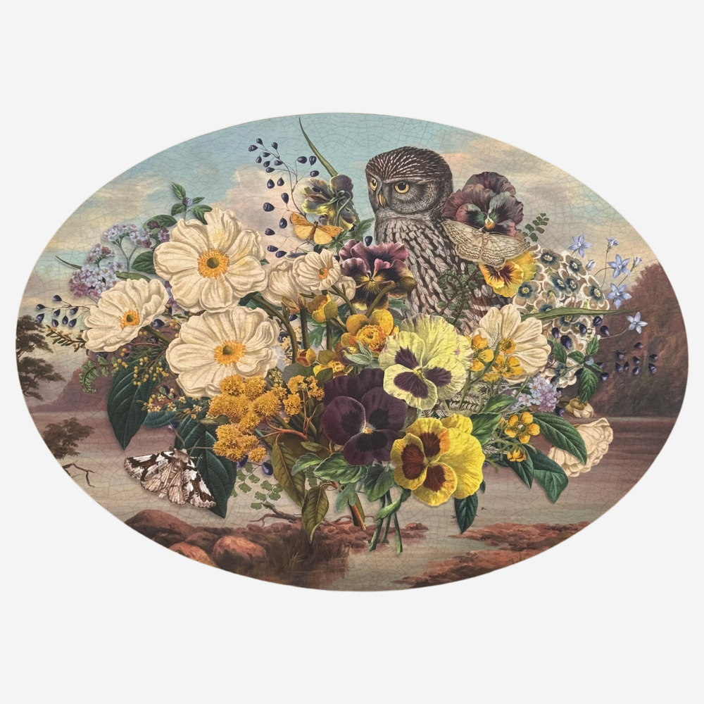 Decorative plate with an owl and floral arrangement on a white background