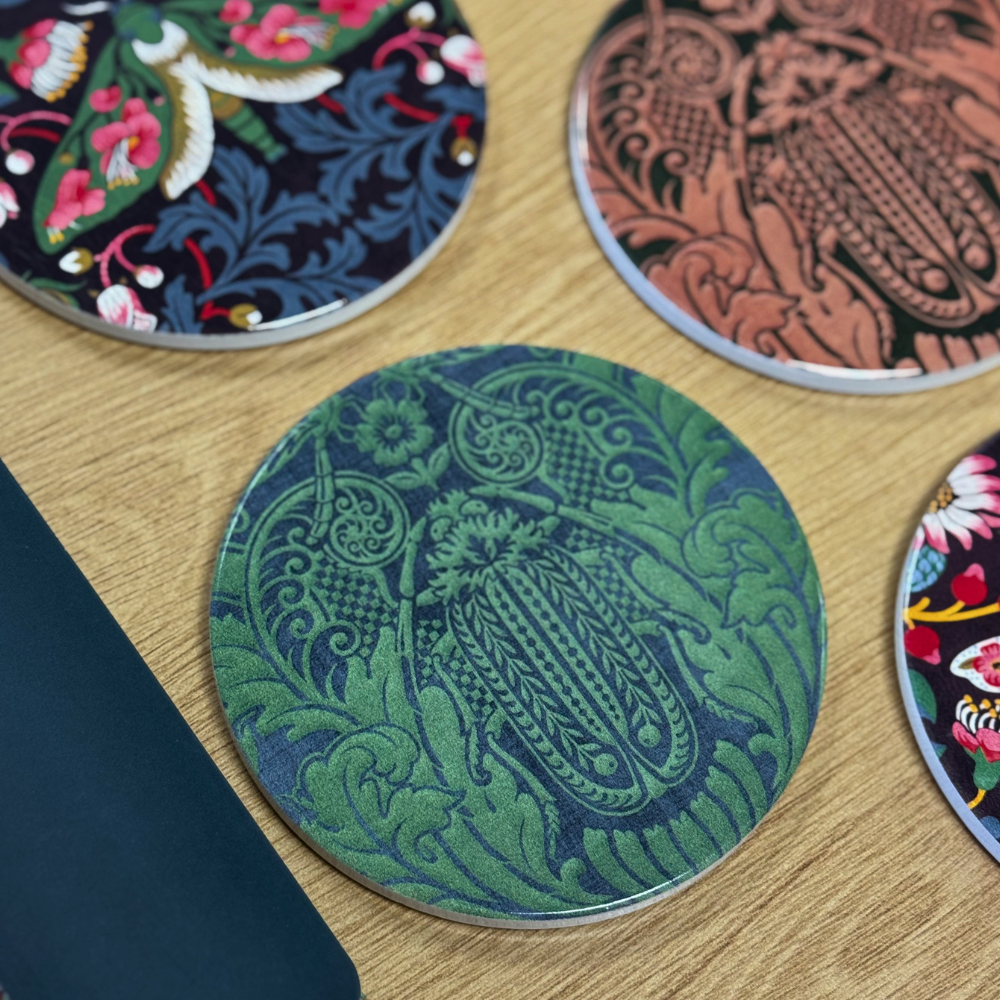 Decorative coasters with intricate designs on a wooden surface